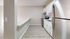 Modern kitchen with sleek stainless steel appliances, stylish cabinetry, and elegant countertops perfect for culinary delights.