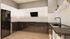 Sleek modern kitchen with high-gloss cabinets, integrated appliances, and elegant lighting, perfect for culinary enthusiasts.