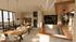 Elegant dining and bar area with modern decor, featuring wooden tables, chic pendant lighting, and a stylish wine rack, perfect for social gatherings.
