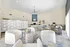 Elegant communal lounge with modern furnishings, cozy seating, and a stylish decorative divider, perfect for relaxation and socializing.