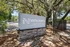 Welcome to Vista North Apartments, featuring elegant signage surrounded by lush greenery and inviting natural landscapes.