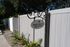 Tranquil outdoor area with a sign for 'Quiet Area for Adults Only,' surrounded by lush greenery and wooden fencing.