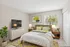 Inviting bedroom with plush bedding, vibrant decor accents, and large windows bringing in natural light, ideal for relaxation.