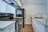 Modern kitchen with sleek appliances, ample counter space, and stylish cabinetry, perfect for culinary creativity.