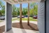 Cozy patio view showcasing lush greenery and vibrant surroundings with convenient parking access.