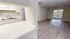 Bright and inviting open floor plan featuring a modern kitchen overlooking a spacious living room with large windows.