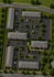 Charming aerial view of a thoughtfully designed apartment complex featuring landscaped pathways, ample parking, and residential buildings along Nebraska Ave and N Lawnwood Cir.