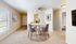 Inviting dining space with a modern round table, elegant chairs, and tasteful decor, perfect for intimate gatherings.