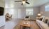 Bright and airy living room with modern decor, featuring a cozy sofa, sleek coffee table, and elegant dining area, perfect for relaxation and entertaining.