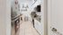 Charming modern kitchen with sleek stainless steel appliances, white cabinets, and inviting granite countertops.