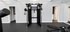 Modern fitness room with sleek exercise equipment and mirrored walls for optimal workouts.
