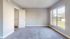Bright and inviting bedroom with a walk-in closet and large window offering scenic views.