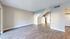 Bright modern living space with elegant wood flooring, versatile layout, and abundant natural light.