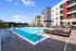 Apartments Near St. Luke's Hospital - The Parq At Chesterfield - Resort-Style Pool With Lounge Chairs, Pool Attached Basketball Rim, And Waterfall