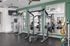 Indoor fitness center with ceiling fans and smith machine