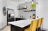 Community kitchen with kitvhen bar and stainless steel appliances