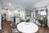 Modern open-plan apartment featuring a bright dining area, sleek kitchen with island, and cozy living room with stylish decor.