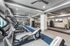 Modern fitness center with state-of-the-art exercise equipment and spacious layout for an invigorating workout experience.