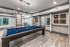 Chic recreational room featuring a stylish pool table with elegant decor and a bright, inviting atmosphere.