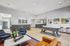 Modern recreational space featuring a stylish pool table, contemporary seating, and vibrant artwork, ideal for social gatherings and relaxation.