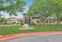 Charming leasing office surrounded by lush greenery at The Foundry apartments.