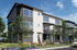 Modern three-story townhouse with large windows, private balconies, and lush landscaping.