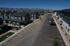 Panoramic view of a modern residential community with stylish houses and clear skies.