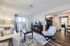Cozy and bright living room with modern furniture, glass table, and elegant decor.