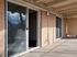Inviting apartment balcony with large sliding glass doors offering natural light and scenic views.