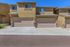 Inviting townhome exterior featuring dual attached garages and serene beige facade, ideal for modern living.
