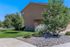 Charming suburban home with lush greenery and a well-maintained landscape in a tranquil neighborhood.