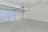 Spacious, clean garage with a modern automated door, perfect for secure parking or versatile storage.