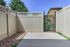 Bright and welcoming patio with privacy fencing, showcasing a tranquil outdoor space perfect for relaxation.