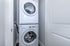 Modern apartment laundry area featuring a sleek stackable washer and dryer set elegantly tucked in a compact space.