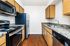 Modern kitchen with wooden cabinetry offering a stylish and functional cooking space.