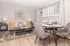 Chic living and dining area featuring modern decor, stylish sofa, and elegant dining table, perfect for cozy gatherings.