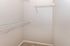 Spacious walk-in closet with sturdy wire shelving, perfect for organized storage and maximizing space.