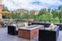 Charming outdoor patio with comfortable seating, stylish fire pit, and stunning mountain views.