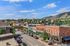 Charming downtown scene of Golden, featuring colorful historic buildings and picturesque mountain views under a bright blue sky.