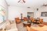 Inviting and spacious living area with cozy seating, elegant decor, and abundant natural light, perfect for relaxation and entertaining.