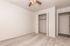 Bright and spacious bedroom featuring fresh carpeting, a ceiling fan, and a roomy closet for ample storage.