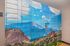 Vibrant package locker with stunning mountain landscape mural, adding a touch of nature-inspired elegance to the apartment amenities.