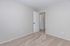 Inviting and freshly painted room with plush carpet, perfect for a cozy bedroom or home office.