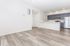Spacious open-concept apartment with sleek hardwood floors, modern kitchen featuring stainless steel appliances and elegant cabinetry, ready for personalization.