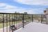 Inviting balcony with serene views of lush greenery, offering a peaceful escape in a picturesque setting.