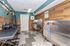 Luxurious pet spa with modern grooming stations, sleek tile walls, and stainless steel wash tubs for pampered pets.
