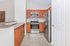 Modern kitchen with sleek stainless steel appliances, elegant wooden cabinetry, and stylish countertops.
