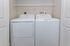 Convenient in-unit laundry room with modern washer and dryer, enhancing your living experience.
