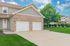 Charming suburban home with a brick facade, double garage, and lush green lawn, perfect for family living.