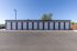 Modern row of sleek garage storage units with clean lines and ample parking space, ideal for secure and convenient storage solutions.